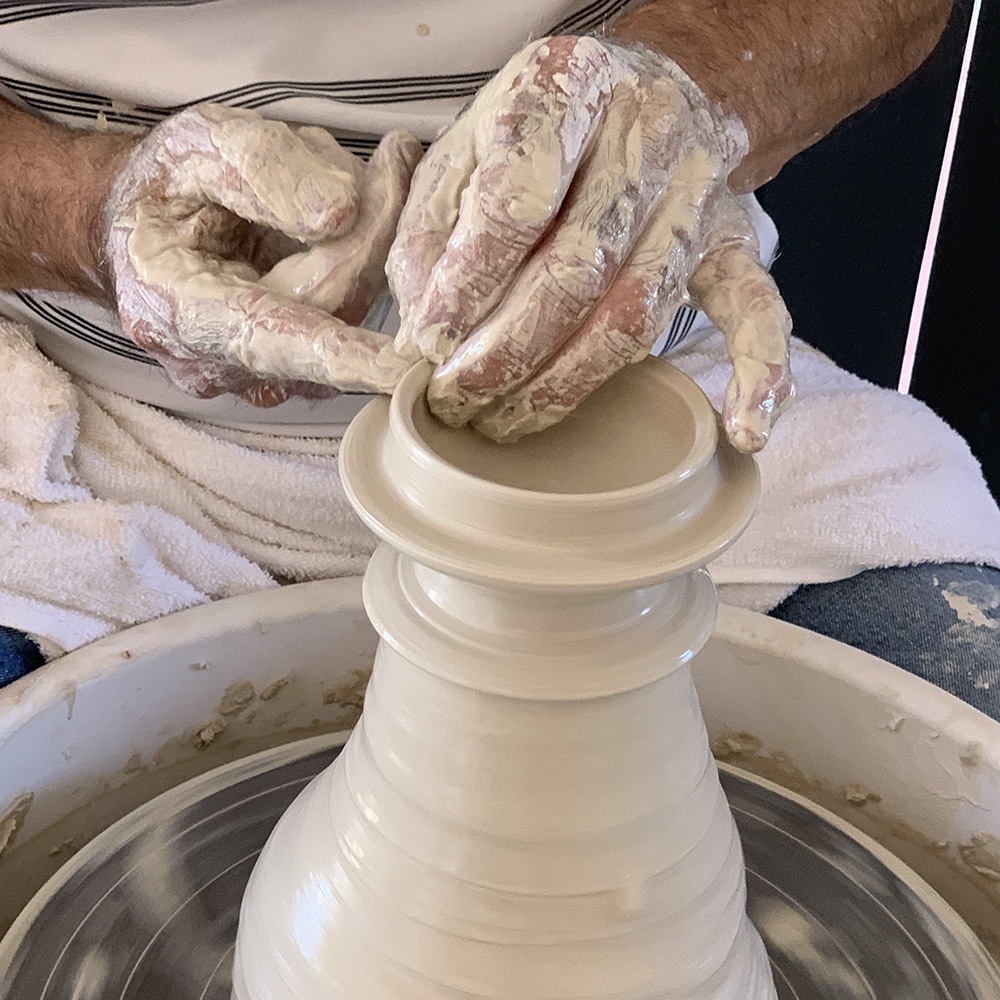 Mandurah pottery teacher throwing lid on pottery wheel